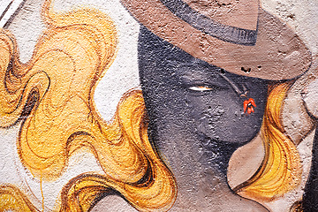 Image showing Graffiti, paint and wall mural in neighborhood with woman illustration and creativity in the city. Urban, art and color on a street with town drawing on a building in Sao Paulo outdoor with craft