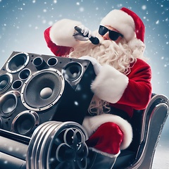 Image showing santa doing karaoke while riding in the sleigh 