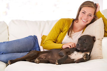 Image showing Woman, dog and relax on couch in portrait, smile for pet love and bonding at home with domestic canine. Happy, positive and trust with foster or adoption, stroke puppy in living room and animal care