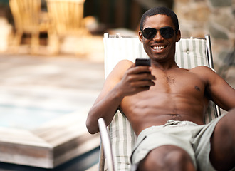 Image showing Man, phone and relax on deckchair, happy and scroll on social media on summer holiday. Black male person, weekend and online for blog or app for chat on travel to Nigeria, vacation and outdoors