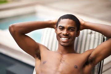 Image showing Man, portrait and relax by pool on chair, happy and swimming on weekend for fun on summer holiday. Black male person, smile and calm or peace on travel to Nigeria, vacation and outdoors for leisure