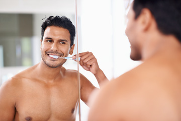 Image showing Oral hygiene, mirror and man in bathroom for brushing teeth, self care and morning routine. Dental, smile and face of male person at home for wellness, toothbrush and cleaning with reflection.