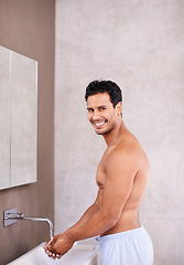 Image showing Portrait, facial hygiene and water with man in bathroom for washing hands, bacteria and healthy skin. Skincare, dermatology and male person for grooming, wellness and morning routine in house.