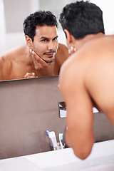 Image showing Skincare, wellness and mirror with man in bathroom for grooming, cleaning and morning routine. Reflection, hygiene and face of male person for self care, dermatology and facial treatment in washroom.