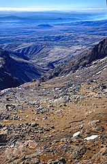 Image showing Mountain, range and nature, landscape for travel and tourism with hiking outdoor. Climate, environment with textures of rocks or stone, fresh air and adventure with journey and natural background