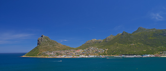 Image showing Beach, drone and mountain on blue sky, paradise and tourist destination for summer vacation in nature. Aerial, ocean and sustainability in cape town, peace and outdoor travel of island environment