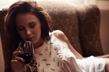 Image showing Woman, couch and wine to relax at home, alcohol and natural ambient light with eyes closed. Smelling, aroma with liquid in glass, comfortable at house after meal in free time on weekend holiday