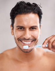 Image showing Dental, portrait and man in bathroom for brushing teeth, self care and morning routine. Oral hygiene, smile and face of Mexican male person at home for wellness, toothbrush and healthy mouth.
