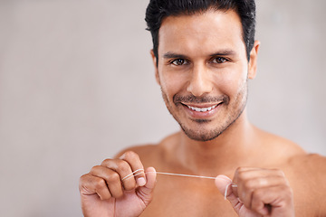 Image showing Dental, portrait and man in bathroom for flossing teeth, self care and morning routine. Oral hygiene, confidence and face of Mexican male person at home for wellness, cleaning and healthy mouth.