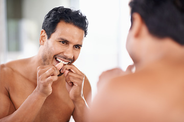 Image showing Dental health, mirror and man in bathroom for teeth cleaning, self care and morning routine. Oral hygiene, tooth and face of male person at home for wellness, flossing and gums with reflection.