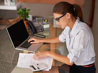 Image showing Woman, laptop and remote work with analysis of finance paperwork, calculator and budget for accounting. Financial clerk, tax audit and review, invoice document for investment report and home office