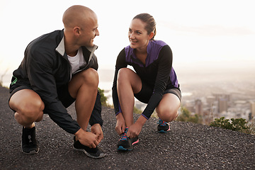 Image showing Running shoes, love and couple in a road for fitness, training or morning cardio in nature together. Sneakers, shoelace and sports runner people outdoor for marathon, routine or performance workout