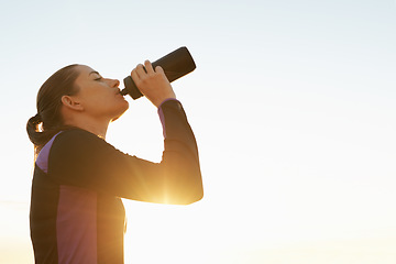 Image showing Woman, fitness and drinking water with sunset for natural sustainability, break or outdoor hydration. Thirsty female person or athlete with liquid bottle after workout, exercise or training on mockup