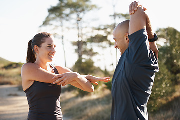 Image showing Fitness, forest and couple stretching arms for workout, commitment and healthy body. Exercise, man and woman in muscle warm up for training, performance and morning in woods with personal trainer.