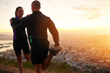 Image showing Sunset, stretching and woman with man for fitness, workout coach and help for healthy body. Exercise, wellness and girl runner with personal trainer in muscle warm up for outdoor training in morning.