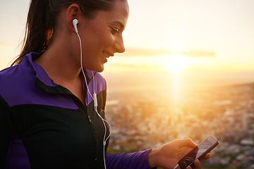 Image showing Happy woman, fitness and earphones with phone in sunset for music, podcast or listening to audio in nature. Female person or runner with smile for streaming, sound or radio player during exercise