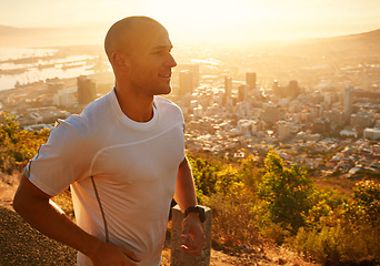 Image showing Fitness, running and man at sunset on cliff for health, wellness and strong body development. Workout, exercise and happy runner on path in nature for marathon training, performance and challenge.