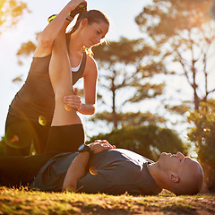 Image showing Nature, help and couple stretching for fitness, workout coach and physio for healthy body. Exercise, wellness and woman with man in muscle warm up for outdoor training in morning on forest ground.