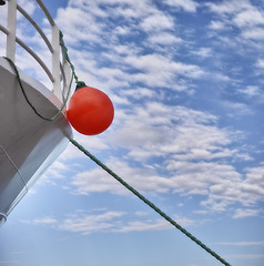 Image showing Buoy, ship and travel with transportation and blue sky, nature and fresh air, vacation or journey on cruise with safety for sailing. Boat, yacht for sea voyage or adventure, luxury and life preserver