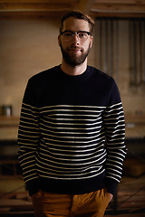 Image showing Man, portrait and calm in home at night, confident and vacation for comfort or weekend in kitchen. Male person, glasses and eyewear for style or wellness, relax and smile on face in apartment