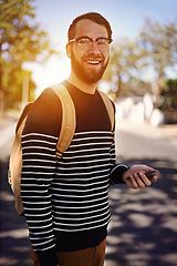 Image showing Man, smile and city with mobile phone in hand for social media or fashion for trend or browsing outdoor. Student, intern or geek and attractive person with confidence in street for hipster and style