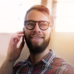 Image showing Happy man, phone call and vision with glasses in discussion, communication or networking at home. Face of male person or freelancer with smile on mobile smartphone for friendly conversation at house