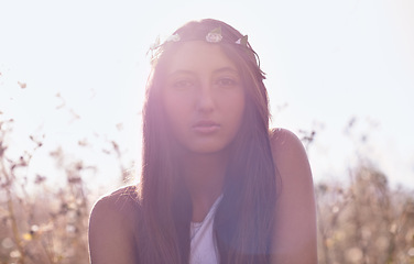 Image showing Woman, portrait and hipster with headband in wheat field or nature for outdoor summer or sunshine. Face of young female person, teenager or brunette in relax for season with lens flare in countryside