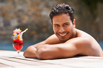 Image showing Man, relax and portrait at swimming pool with cocktail at hotel, resort and travel on luxury vacation. Summer, holiday and glass of alcohol to drink with happiness on deck at poolside in Mexico