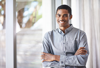 Image showing Happy black man, portrait and window with arms crossed for career ambition, job or creative startup at office. African male person or employee smile in confidence for expertise or positive mindset