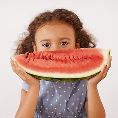 Image showing Portrait, eyes or girl with watermelon in studio for healthy, diet or wellness on grey background. Fruit, hiding or kid model face with gut health, nutrition or organic snack for digestion support