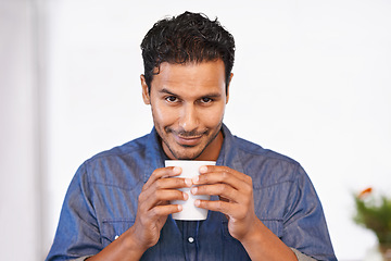 Image showing Calm, man and drink on coffee break in home, morning with peace and happiness with Mexican espresso. Person, smile and relax with latte, matcha or tea in white background of house with mock up space