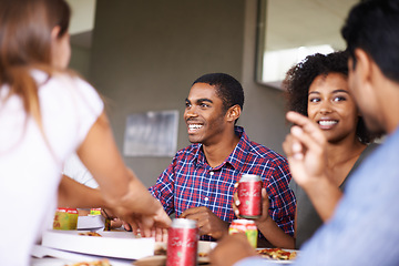 Image showing Friends, man and eating of pizza in home with happiness, soda and social gathering for bonding in dining room. Men, women and fast food with smile, talking and diversity at table in lounge of house