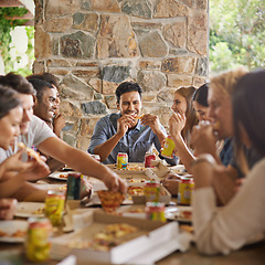 Image showing Friends, happiness and eating of pizza in home with talking, soda and social gathering for bonding in dining room. Men, women and fast food with smile, drinks or diversity at table in lounge of house