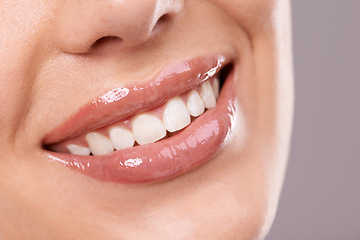 Image showing Teeth, dental and woman with smile in studio, health and wellness with oral hygiene on grey background. Orthodontics, fresh breathe and whitening for veneers, happy model with glow and self care