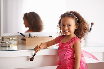 Image showing Child, portrait and mirror with makeup for costume, ballet or performance with cosmetics or brush. Girl, smile and reflection of a happy kid in with a princess dress or outfit in the home or house