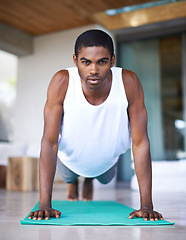 Image showing Fitness, portrait and black man do yoga on floor for wellness, flexibility and balance for healthy body. Training, pilates and person on sports mat for stretching, workout and exercise in living room