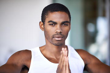 Image showing Black man, portrait and praying hands with faith for religion, hope and grateful mindset at home. African person, serious face and peace with spiritual gesture for mindfulness, worship and praise