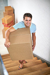 Image showing Man, portrait and boxes in new house by stairs with smile, fresh start and investment in real estate. Person, cardboard and package on steps in apartment, home and happy for rent, moving or property