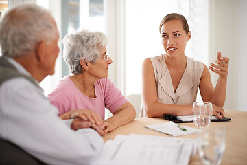 Image showing Senior, couple or financial advisor with discussion for insurance, retirement planning or contract documents by table. Elderly, people or consultant with paperwork for title deed or pension agreement