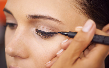 Image showing Woman, makeup and eyeliner with mascara for beauty, cosmetics or art at salon or spa. Closeup of female person or stylist applying pencil shadow, contour or color for facial eye treatment or glamour