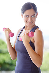 Image showing Woman, portrait and dumbbell with lifting weights for fitness outdoor with smile, wellness or healthy body. Athlete, person and face with training equipment for exercise, workout or physical activity