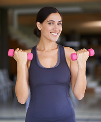 Image showing Woman, portrait and dumbbell with weightlifting for fitness in gym with happiness, wellness or healthy body. Athlete, person and training equipment for exercise, workout or physical activity for arms