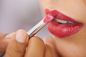 Image showing Closeup, woman and lipstick brush on lips for beauty with hands, application of cosmetics product and glamour. Person, mouth and color makeup for skincare, aesthetic makeover and cosmetology at salon