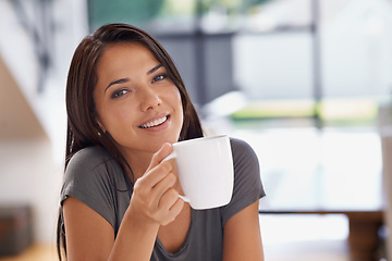 Image showing Portrait, coffee and relax with woman in kitchen of home to relax in morning or on weekend time off. Face, smile and mug with happy young person drinking tea in apartment for peace or wellness