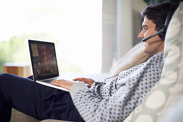 Image showing Man, call center or remote work with laptop for customer service, typing or consulting online. Home, virtual assistant or headset on a happy freelance employee with smile for communication or support