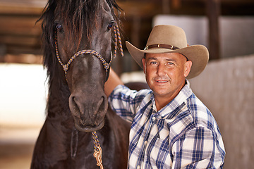 Image showing Cowboy, man and horse in stable for portrait with care, growth and development at farm, ranch or countryside. Person, animal or pet with love, connection and bonding for wellness with nature in Texas