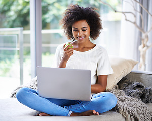 Image showing Apple, smile and woman on sofa with laptop for social media, lifestyle blog and food website at home in Houston. Happy female person, technology and fruit for nutrition, healthy diet and clean eating