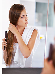 Image showing Mirror, woman and brush hair in home bathroom for beauty, care or morning routine with cosmetics. Reflection, hairstyle and serious person combing for cleaning, hygiene and treatment for wellness