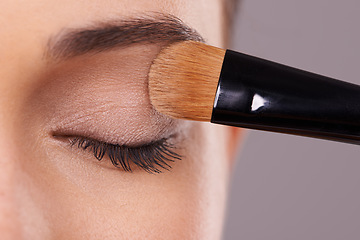 Image showing Closeup, eyelash and brush for eyeshadow with woman, makeup and beauty with application on purple background. Cosmetology, transformation and cosmetic care with tools, powder product and shine