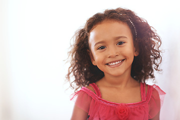 Image showing Girl, child and portrait or happiness in home with confidence, wellness and headband for fashion aesthetic. Kid, face and smile with relax on mockup in living room with pride, good mood or curly hair